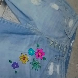 Girls jeans shorts hand painted.